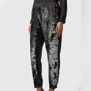 Women’s TOPSHOP black sequin Joggers. Size 6 US, 38 Euro.